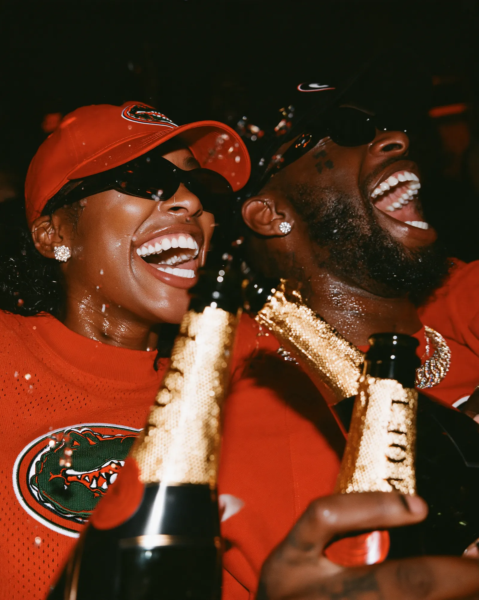 Two guests in Florida and Georgia red laughing with bottles up